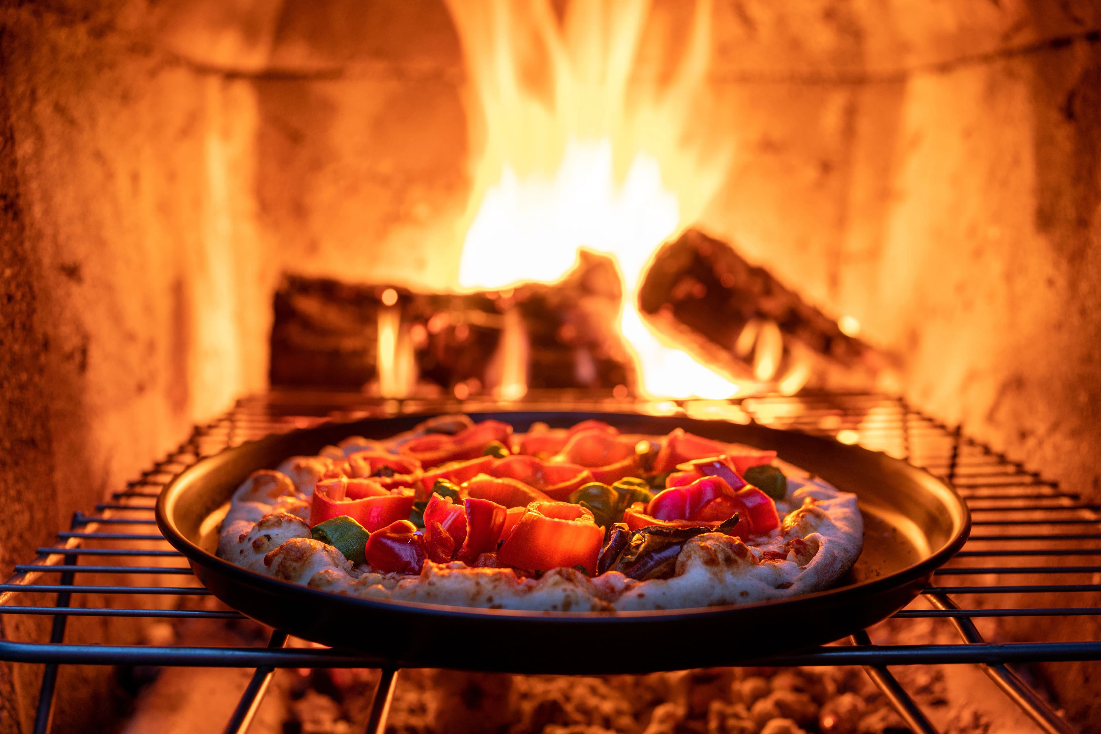 an open coal fired pizza oven New Haven with active flames