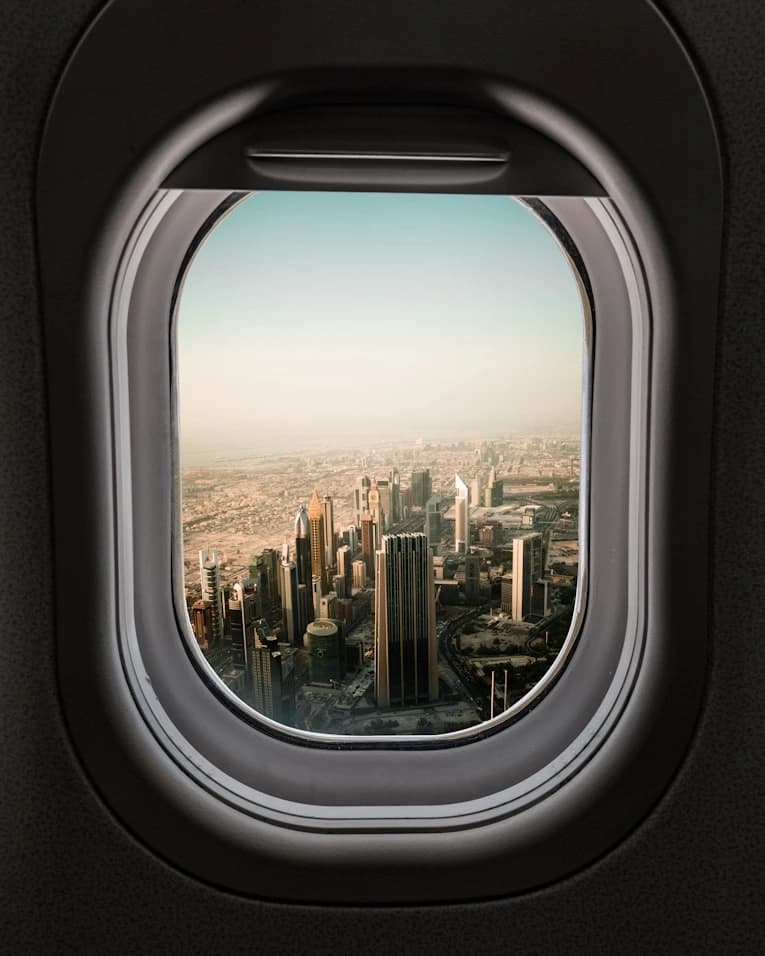 Business class cabin seat on a long-haul flight with window view