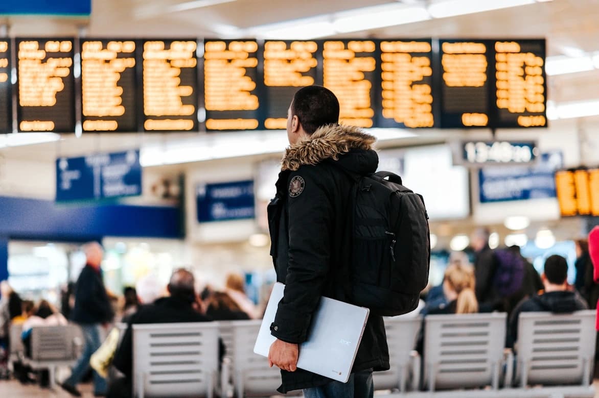 Frequent Traveler checking in at an airport counter with a boarding pass with loyalty programs