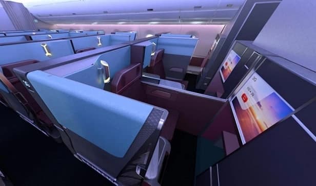 jal business class seat with privacy suite with burgundy leather seating and personal entertainment screen